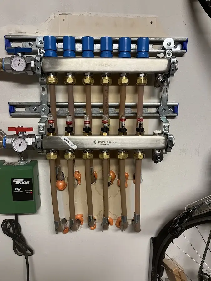 Plumber performing Water Heater Repair at a residential property in Warsaw